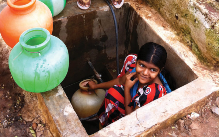 Residents of Hubli-Dharwad fill storage containers to ensure they have continuous access to water in the face of an intermittent supply water system. Because water pressure in the pipes is often so low, the faucet is located below ground level, and frequently floods during the rainy season. Credit: Kara Nelson